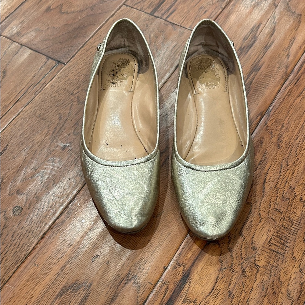 Vince camuto gold flats. Gently worn. Still in excellent condition. Size 7